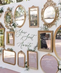 a white wall with gold frames and mirrors on it that says you've got married