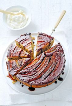 a sliced cake on a plate with chocolate sauce