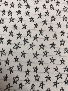 black and white stars drawn on lined paper