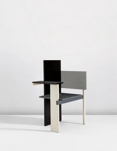 a black and white chair sitting on top of a table