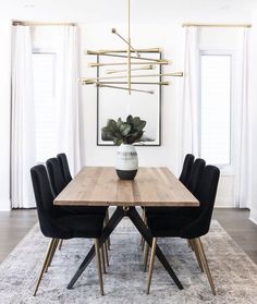 the instagram page shows an image of a dining room table with black chairs and a potted plant