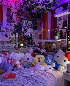 a bed with lots of stuffed animals on top of it in a room filled with posters