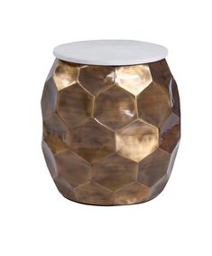 a gold and white stool with hexagonal design