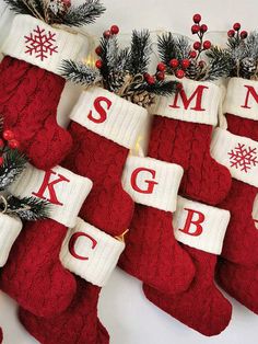 christmas stockings with monogrammed letters hanging from them