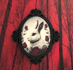 an image of a rabbit with roses on it's face in front of trees