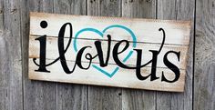 a wooden sign that says i love us with a heart and the word's on it