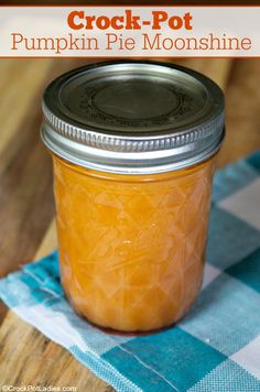 crock - pot pumpkin pie moonsshine in a mason jar on a checkered tablecloth