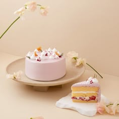 a piece of cake sitting on top of a plate next to a slice of cake