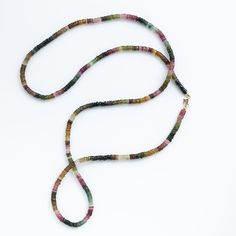 Gemstone: multicolor tourmaline Metal: 14-Karat Gold or Gold Filled;  color: yellow Closure: lobster clasp Length: available options: 22 inch (55.88 cm), 24 inch (60.96 cm), 26 inch (60.04 cm), 32 inch (58.42 cm) Comes in a designer box. Handmade in the USA Box Handmade, Tourmaline Necklace, Heishi Beads, Lobster Clasp, Tourmaline, Necklace Etsy, Gold Filled, Necklace Lengths, Color Mixing