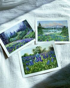 three pictures of blue flowers on a white sheet with trees and water in the background