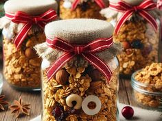 homemade granola in a jar decorated as a face with googly eyes and red ribbon