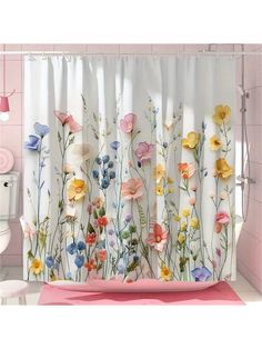 the shower curtain is decorated with colorful flowers