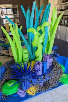 blue and green decorations on top of a table