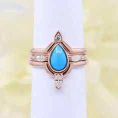 > Metal: 14K Solid white, yellow, and rose gold (18K available please contact us)> Center Stone : 8x5 mm Natural Turquoise> Center Stone shape: Pear Shape> Center Stone Weight: Approx. 0.8ct> Band Width: 1.6mmMade to Order, All Handmade in the United States.18K Available upon request please contact us. Turquoise Engagement Ring, Turquoise Wedding Rings, Turquoise Ring Engagement, Rose Gold Promise Ring, Diamond Band Engagement Ring, Turquoise Wedding, Diamond Crown, Diamond Engagement Ring Set, Diamond Rings Bands