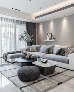 a modern living room with grey and white furniture