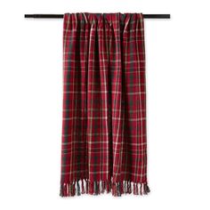 a red and black plaid scarf hanging on a clothes line