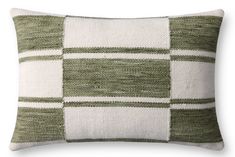 a green and white checkered pillow on a white background