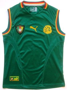 a green jersey with yellow and red stripes on the chest, sitting on a white surface