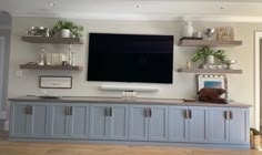 a flat screen tv mounted to the side of a wall