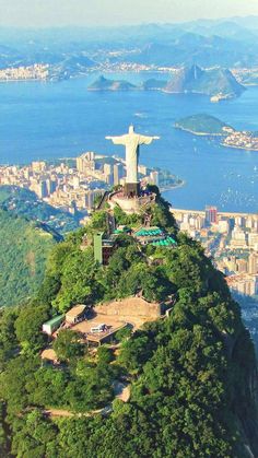 an aerial view of the statue of christ on top of a mountain in rio, brazil