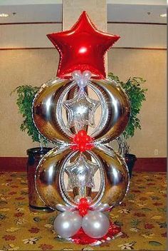 a star balloon company christmas tree with silver and red balloons