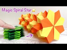 an origami star is being made out of folded paper and placed on top of each other