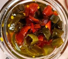 pickled peppers and corn in a glass jar