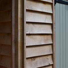 the side of a building with wooden slats