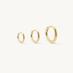 The Viviana Round Hinged Mini Hoop Earrings are perfect for adding a touch of elegance to your everyday look. Available in 3 different sizes, these simple hoops will match your style perfectly. Elevate your outfit with the timeless beauty of these mini hoops! What's Included: Premium Ideaure Jewelry Polishing Cloth™ Complimentary Gift Packaging Size (Diameter): 10mm, 12mm, 15mmWidth: 3mmMaterials: 14K Yellow Gold Filled or 925 Sterling Silver (Rhodium Plated) Gold Huggie Earrings, Crossover Ring, Mini Hoop Earrings, Earrings Dainty, Cross Ring, Cross Bracelet, Earrings Minimalist, Huggie Earrings, Polish Jewelry