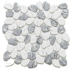 white and grey pebbles are arranged on the floor