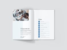 an open brochure with people working on computers