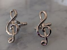 Channel your inner musician with these delightful treble clef note cufflinks. Made with attention to detail, this pair of silver toned cuffs will be a welcome addition to any music lovers wardrobe. Perfect gift for him. Comes packed in a deluxe black gift box. Victorian Men, Goth Music, Monster Dolls, Treble Clef, Musical Note, Tie Tack, Music Note, Black Gift Boxes, Perfect Gift For Him