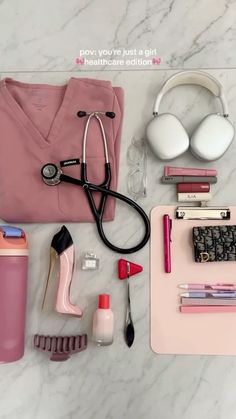 the contents of a woman's personal care kit laid out on a marble surface