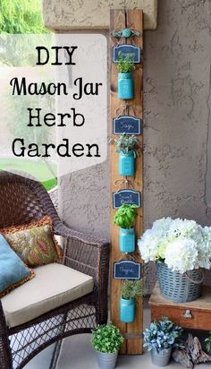 an outdoor garden with potted plants and hanging mason jar herb garden on the side