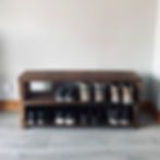 a blurry photo of an empty room with a bench and coffee cups on the floor