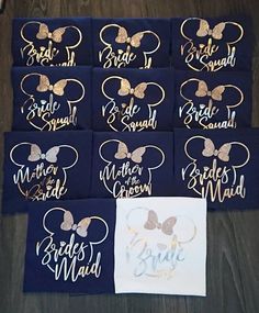 12 mickey mouse name tags with gold and silver glitter bows on navy blue cottons