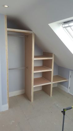 an empty room with some shelves in it