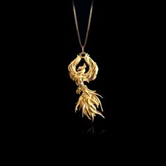 Elevate your style with our 14k Gold Phoenix Pendant, a symbol of rebirth and beauty. This solid gold Phoenix necklace captures mythological charm. Explore our collection of Phoenix-themed jewelry, including elegant gold medallions, perfect for those seeking a unique and meaningful piece inspired by the Phoenix's symbolism. PENDANT INFORMATIONThis pendant is made of real, solid gold.• Made in USA• Material: 14k or 18k solid gold• Finish: polished• Height: 1.5" (38,5 mm) | *includes the small circle, bail dimensions not included• Width: 0.85" (21,5 mm)• Pendant weight: approx. 6 grams (14k)• Bail: fits up to 4 mm chains• Solid back, not hollow• A certificate of authenticity is included• Delivered in our elegant jewelry box, making it the perfect gift Shipping: All of our orders are custom-m Gold Nature-inspired Necklace With Large Pendant, Nature-inspired Yellow Gold Pendant Jewelry, Phoenix Symbolism, Baby Bracelet Gold, Phoenix Jewelry, Jewel Design, Phoenix Necklace, Phoenix Pendant, Gold Dragon