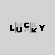 the word lucky in black and white on a gray background