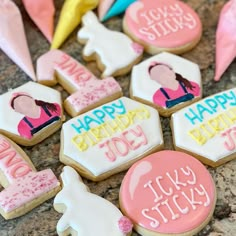 decorated cookies with happy birthday messages are on the counter top for someone's special occasion