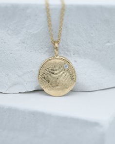 Fingerprint Necklace in solid 10k, 14k or 18k yellow, rose or white gold on a heavy chain with a diamond made using your loved ones’ actual fingerprints. You can use our Fingerprint Kit to get imprints of babies, adults and animals. Each piece is made to order in our studio in New York. Every piece of our jewelry comes in our signature Matanai packaging, complete with a polishing cloth and care instructions. There is no extra charge for a double-sided fingerprint piece. DetailsMaterial: solid 10 Push Present Necklace, Push Present Jewelry, Push Present, Push Presents, Fingerprint Necklace, Cool Fathers Day Gifts, Heavy Chain, Baby Keepsake, Simple Prints