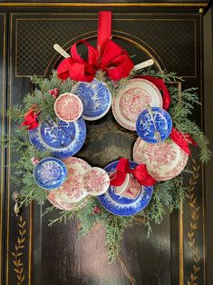 a wreath with plates and bows on it