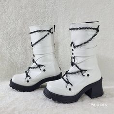 White Vegan Leather With Black Platform Heel And Decor 2 3/4" (70mm) Chunky Heel, 1" (25mm) Platform Mid-Calf Boot Pyramid Ring, Screw Studs, Hanging Skull O-Ring And Metal Chain Detailing On The Vamp Back Metal Zip Closure Brand New In Box From Demonia Dead Stock - Will Not Be Restocked Edgy White Platform Boots, White Punk Platform Boots, Edgy White Platform Boots With Round Toe, White Leather Edgy Platform Boots, Edgy White Leather Platform Boots, White Edgy Platform Boots For Streetwear, White Platform Boots For Winter Streetwear, White Platform Boots For Streetwear In Winter, White Winter Platform Boots For Streetwear