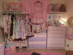 a bedroom with pink carpet and lots of clothes