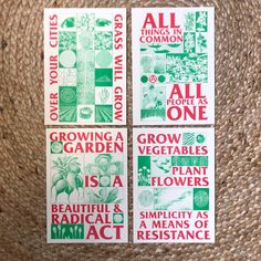 four seed packets are sitting on top of a woven mat, with the words growing a garden written in red and green