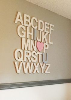 the letters and numbers are cut out of wood