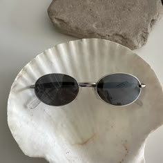 These round oval sunglasses are your everyday classic.  Featuring a silver frame with smoke mirror lens.  This style is unisex.  True genuine vintage sunglasses from the 90s.   - 400 uv  - new vintage from the 90s - includes sunglasses pouch Silver Mirror Sunglasses, Retro Silver Polarized Sunglasses, Silver Sunglasses With Uv Protection For Streetwear, Vintage Silver Sunglasses For Summer, Silver Sunglasses For Summer Streetwear, 90s Sunglasses Vintage, Oval Sunglasses 90s, Wire Sunglasses, Sunglasses Mirror