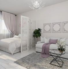 a white living room with two couches and a bed