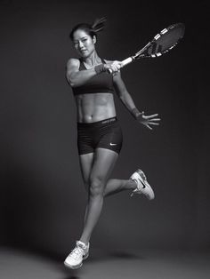 a woman holding a tennis racquet on top of a black and white photo