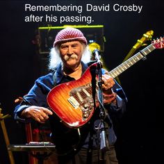 an older man holding a guitar in front of a microphone with the caption, remembering david crossby after his passing